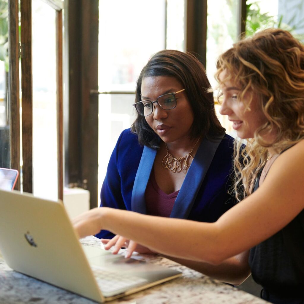 two women look up information using google search generative experience