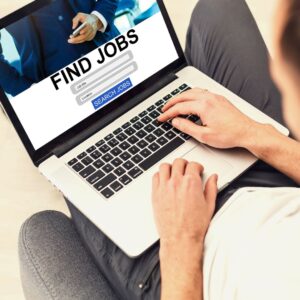 a woman on her computer looking to find a job
